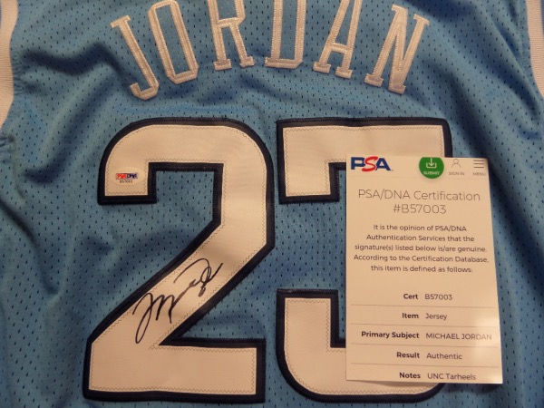 This 1980's styled road powder blue is a North Carolina gem, and has sewn on everything as well as name on back. It comes back #23 signed by Mike in bold, clean black sharpie, and value is thousands. It has a numbered, lifetime PSA/DNA hologram intact, and sells here with NO reserve! 