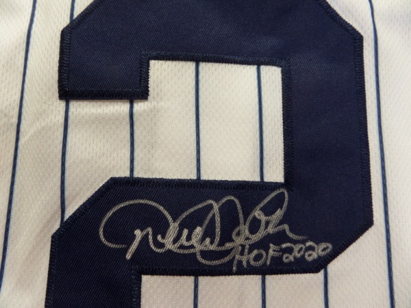 This home white, pinstriped size 44 New York Yankees jersey from Nike still has original tagging attached, and comes back number-signed in silver sharpie by future HOF Yankees shortstop Derek Jeter!  Signature grades an overall 9, and includes a HOF 2020 inscription!  Awesome Yankees item, ideal for framing and display, and retail is low thousands