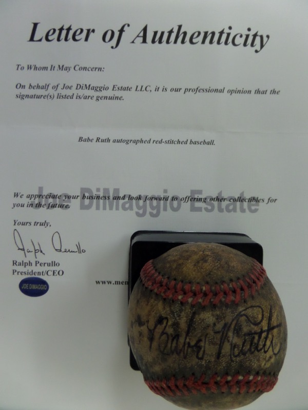 This incredibly old, well-worn baseball is laced in red, with no discernible manufacturer's labels or markings, and is in P+/F overall condition.  It is hand-signed against the sweet spot in black fountain pen ink by The Bambino himself, grading a light but legible 5.5, and is fully Joe DiMaggio Estate certified for your assurance.  Valued at $10,000 all day long!