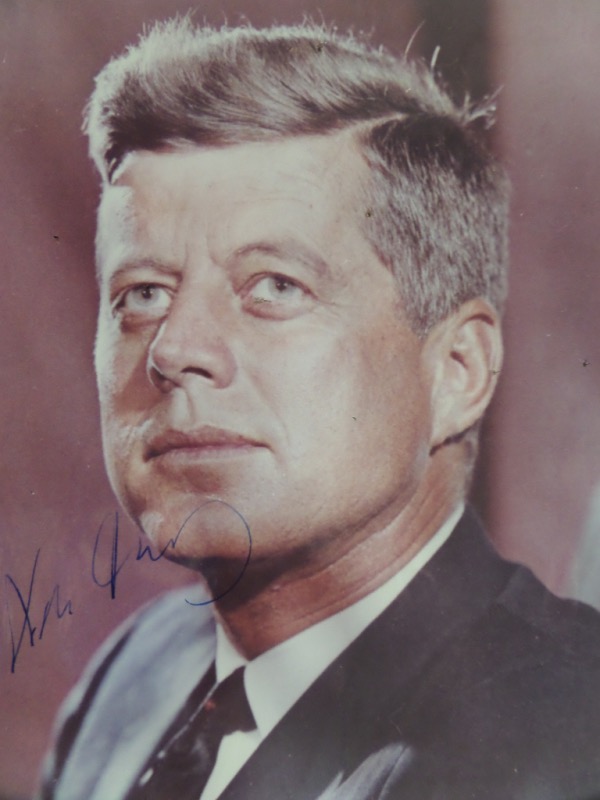 This full color, original 5x7 photo is a close up image of then-President, John F. Kennedy.  It shows some corner wear on the top, but is in EX/EX+ shape, and comes hand-signed in blue by the 35th President of the United States.  The signature grades a legible 6 overall, and the photo is perfect for framing and display.  A TRUE piece of US History and Americana, and with this great man's tragic assassination coming up on 60 years ago, retail is well, WELL into the thousands!