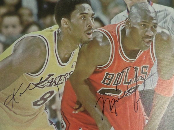 This awesome 20x28 real canvas work shows both NBA Greats in a court shot and comes hand signed by each on a terrific spot. It grades a clean bold 10 all over, shows off well from 30 feet away, and value with both HOF Greats on it is about $3200.00.