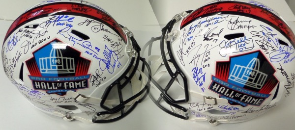 This Pro Football Hall of Fame logo full size replica helmet is in NM condition, and comes hand-signed all over in blue, silver and black by no less than 43 gridiron greats, many of whom are no longer living.  Included are Manning, Bradshaw, Young, E. Smith, Namath, Marino, Lewis, Moss, Long, Dawkins, Irvin, Montana, Elway, Swann, Rice, LT, the other LT, Sanders, the other Sanders, Kelly, T.O., Urlacher and many more.  With so many all time greats present, and many deceased, retail is well, well into the thousands!