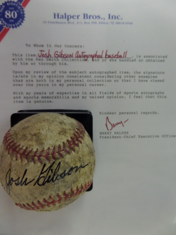 This vintage, unmarked, red-laced baseball is in G/G+ condition overall, and is black ink-signed across the sweet spot by longtime Negro League great, Josh Gibson.  The signature grades a strong, legible 7, and the baseball comes with a COA from Barry Halper at Halper Bros., Inc. for authenticity purposes.  An outstanding collector's item, valued at $10,000, and just look at that low, low minimum bid!