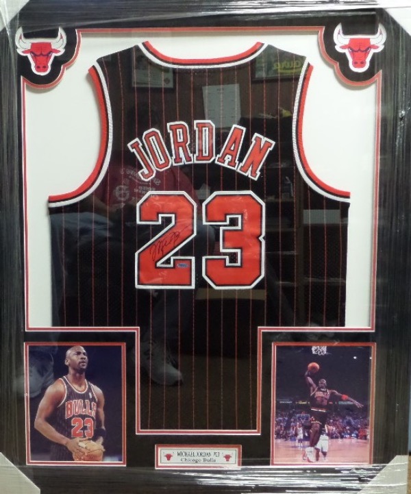 This spectacular display is 3x4 FEET in size, and comes custom triple matted in red, black and white Bulls team colors. It has 4 custom cutouts, but the main piece is an INPerson Authentics hologrammed 1997 game jersey from Jordan. It is signed in bold black sharpie, has Lee's added ok for certainty, and shows off well from a football field away!  Great investment chance, and we'll guess value at $12,000 after PRO framing.