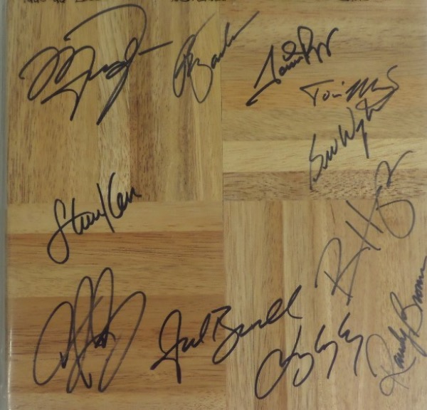 This MINT condition 12x12 wooden floor board piece features a Bulls logo in the center and comes nicely black sharpie signed all around by 11 members of this World Champion club!  Included are Jackson, Jordan, Pippen, Rodman, Kerr, Kukoc, Longley, Harper and the rest, and this baby will show off fabulously in any collection!