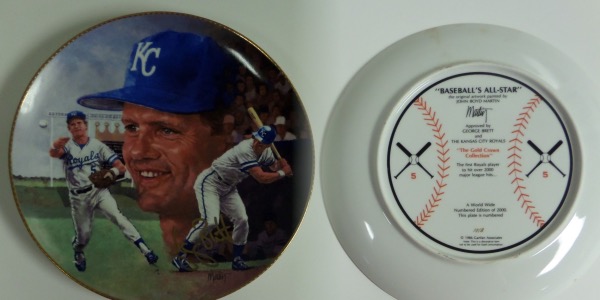 This gold-rimmed 10" diameter collector's plate is from 1986, and numbered 1018 out of 2000 produced.  It is colorful, features three different images of Royals' HOF'er George Brett, and comes gold sharpie signed by the 3rd base legend himself.  As with anything Gartlan, authenticity is absolute, and this plate is valued into the mid hundreds!