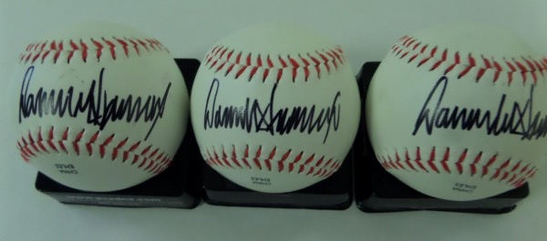 All 3 of these balls are gem mint clean, white and perfect, and all come IN PERSON obtained and black sharpie sweet spot signed by our much maligned former President. All 3 are clean and bold, value is well over a grand on the Rawlngs lot, and as always, we'll sell em' with NO reserve! 