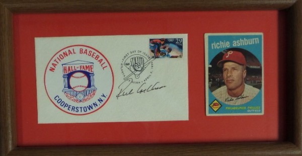 This compact but mighty 7x13 wood-framed and Phillies red-matted display houses a Richie Ashburn Topps baseball card, which looks to be original, and a 1992 stamped Cooperstown HOF First Day of Issue cachet.  The envelope is hand-signed in black flair pen by HOF Phillies outfielder Richie Ashburn, and this 100% display-ready piece is valued well into the hundreds!