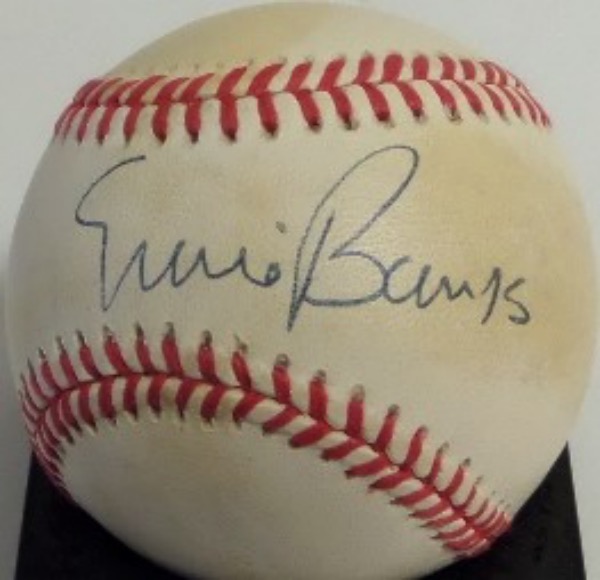This Official NL baseball from Rawlings is cubed in VG shape overall, and comes hand signed on the sweet spot in blue ink by Cubs HOF shortstop, Ernie Banks.  Signature grades a legible 8 overall, and the ball comes affixed with a sticker from PSA/DNA (C13901) for your assurance.  Valued well into the hundreds from this deceased HOF great!