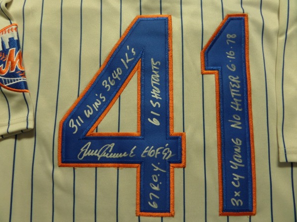This pinstriped 1969 New York Mets throwback jersey from M&N is tagged as new, and comes trimmed in blue and orange, with everything sewn.  It is back number-signed in silver by the 3 time Cy Young winner and HOF great himself, including No Hitter 6-16-78, HOF '92, 311 Wins, 61 Shutouts, 3X Cy Young and 3640 K's inscriptions, and retail from this deceased ace is high hundreds!