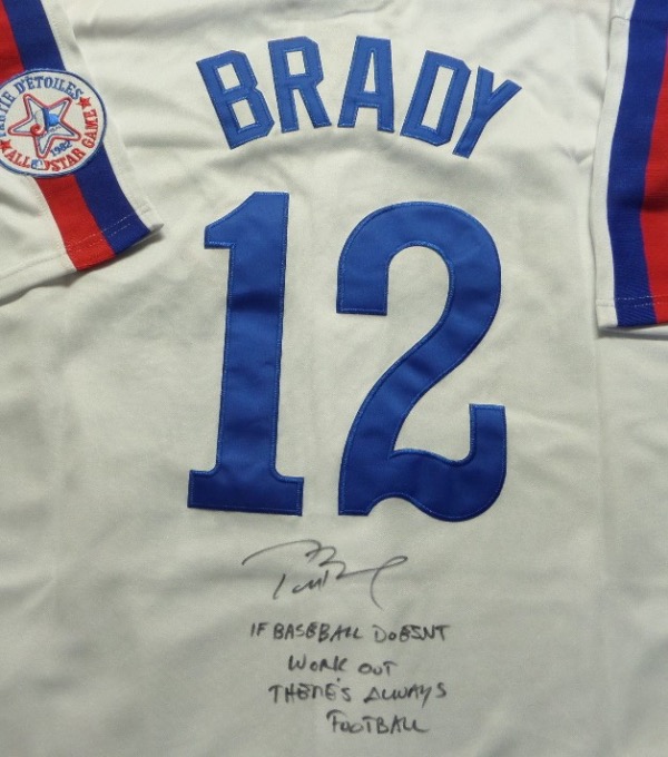 Why a Brady signed Expos jersey?  I actually had to look that one up myself.  He was actually selected by the team in the 18th round of the 1995 MLB draft.  Who knew?  So that's why we have this white size L Expos throwback jersey from Mitchell & Ness is back-signed below the back number in black sharpie by the future Hall of Fame NFL star, complete with a cool IF BASEBALL DOESN'T WORK OUT, THERE'S ALWAYS FOOTBALL inscription.  A great looking jersey, and an unique collector's item, and retail is ???