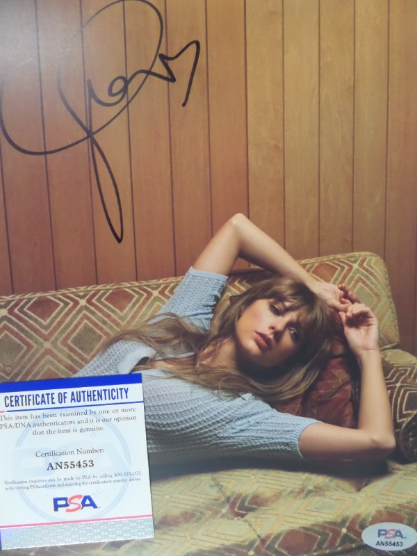 This $400.00 color 8x10 is a rare image of the pop star lying on an old couch in her original Pa. home, and shows her from High School days. Great image, hand signed above in bold black marker, and complete with a numbered, original PSA sticker. It is consigned right from Aaron Kinloch for certainty, and as always, we'll sell it with NO reserve! 