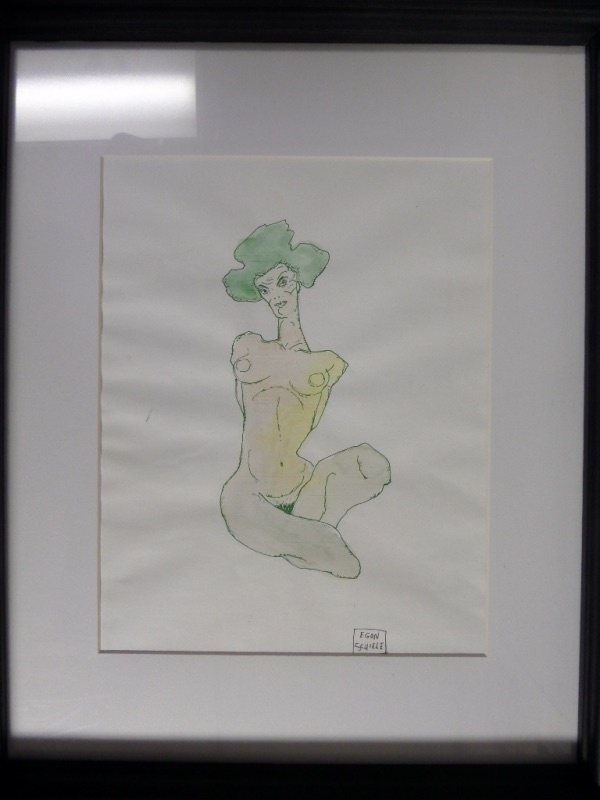 This master work is large at 18x22, comes to you matted in white and wood framed in black, and holds a signed original by Egon. It shows a posing naked lady, green hair and looking right at you, while signed across the bottom as an added bonus. High value, and no reserve!