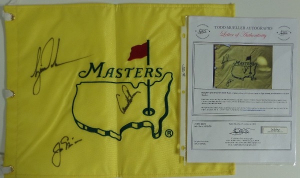 This NM/MT condition yellow Masters pin flag features an embroidered logo, and comes hand-signed in black sharpie by three of the greatest golfers of all time.  Included are Tiger Woods, Jack Nicklaus and Arnold Palmer, with signatures bleeding slightly and grading fair 7's each, and the flag is accompanied by a full photo LOA from Todd Mueller Autographs, one of the most reputable in the biz!  Awesome golf collector's item, and retail is low thousands, to be sure!!!