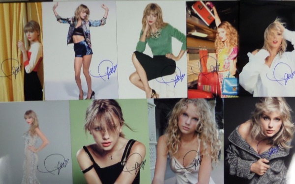 This ideal group lot is FOURTEEN full color 8x10 photos, including concert shots, poses, and all kinds of colorful images, each hand-signed by the superstar pop/country singer.  Each photo can retail into the hundreds with the huge popularity of Swift, so you do the math with FOURTEEN!!!