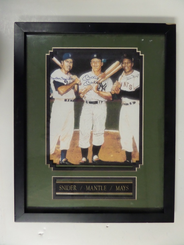 This 12x15 custom framed and double-matted display features a full color Ron Lewis print of the three famed NY centerfielders of the 1950's.  It is hand-signed in blue sharpie by Mickey Mantle and Duke Snider, and in black by Willie Mays, with all three signatures grading 8's or better.  Comes with a COA from Mas Baseball World for authenticity, and retail is low thousands!