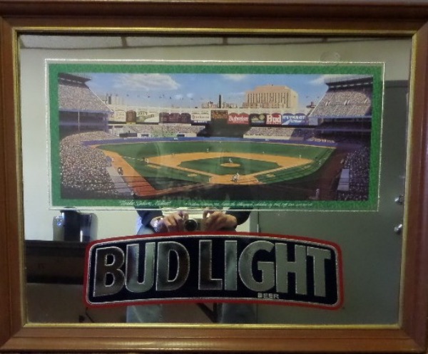 This official Budweiser Bud Light Beer wood-framed mirror measures 27x35 in size, is in EX overall condition, and, according to our consignor, hung on a wall at Yankee Stadium, by the clubhouse!  This spectacular mirror was obtained by the Budweiser distributor for the Old Yankee Stadium, and has since been acquired by our consignor!  A truly one of a kind piece, and a MUST for any Yankee fan with a SERIOUS collection!