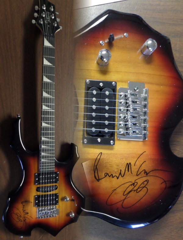 This gorgeous mint electric sunburst stratocaster style guitar comes with the original box, pick ups, bag, straps,etc. and comes signed by the best singer/songwriter of all time in black. SUPERB autograph and shows off wonderfully. Guaranteed authentic and get it now because Paul is a tough autograph and not getting any younger! He even included a smiling face under his tough-to-get signature!  WOW