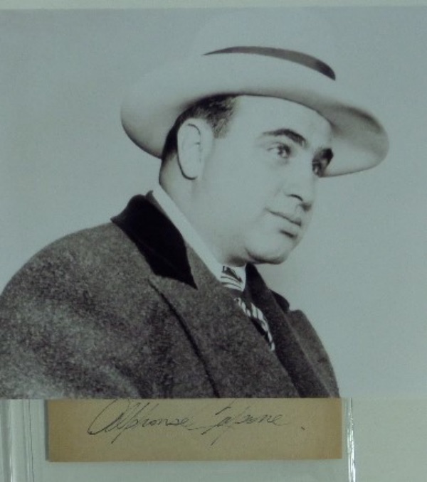 This 1x5.5 cut of light brown paper features a black ink signature from 1920's crime boss, Al Capone.  The signature grades an overall 5-5.5, and the cut comes with a black and white photo for matting and framing!  With Capone gone now more than 75 years, retail is low thousands!