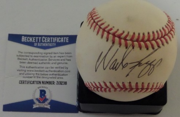 This Official American League Baseball from Rawlings (Bobby Brown) is cubed in VG shape, with light and even toning throughout.  It is hand-signed in black ink on the sweet spot by 5 time AL Batting Champ and HOF Red Sox/Yankees 3rd baseman, Wade Boggs!  The signature grades a legible 8.5, and the ball includes a COA from Beckett Authentication Services (Z13238) for rock solid authenticity.  Valued into the mid/high hundreds!
