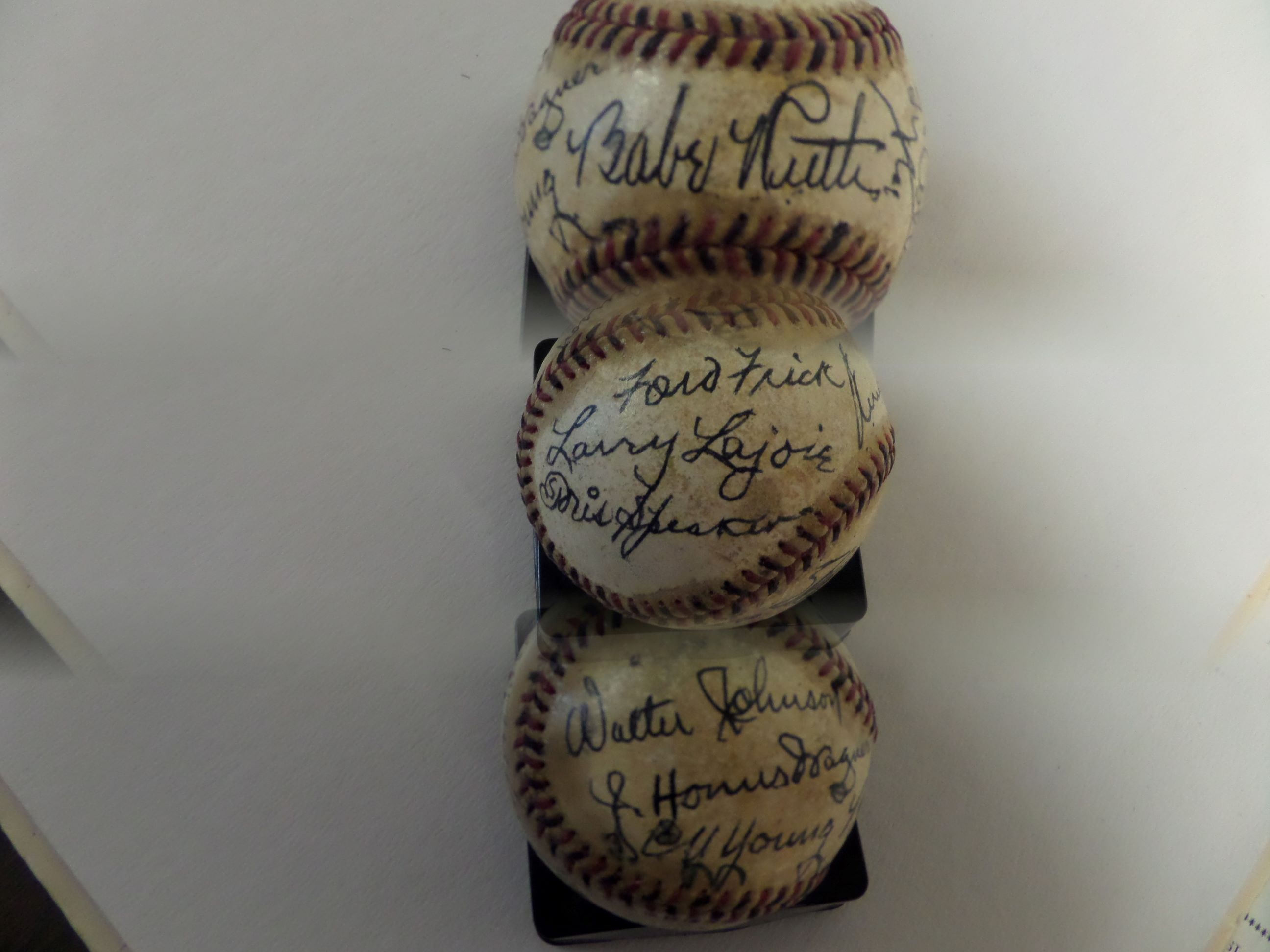 This red and black sticthed ball shows some usage, is about cream colored, and comes black ink, boldly signed by 15 HOF Inductees. I see amazing HOF signatures from Walter Johnson, Honus Wagner, Cy Young, Babe Ruth, Ty Cobb, Tris Speaker, Nap Lajoie and more! Amazing attic find, and value is priceless!