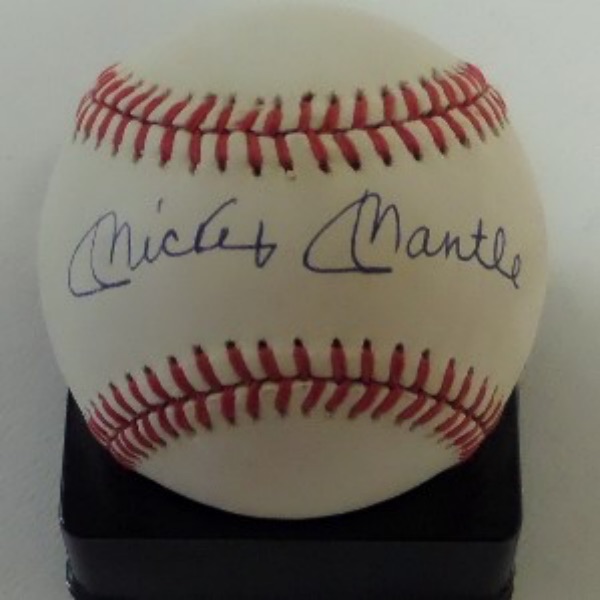 This Official 1988 World Series baseball from Rawlings is cubed in EX/EX+ shape overall, and comes hand-signed right across the sweet spot in blue ink by all time great and NYY HOF'er, Mickey Mantle!  The signature grades a strong, clean 9 overall, and with The Mick's death now 30 years ago, retail is high hundreds!