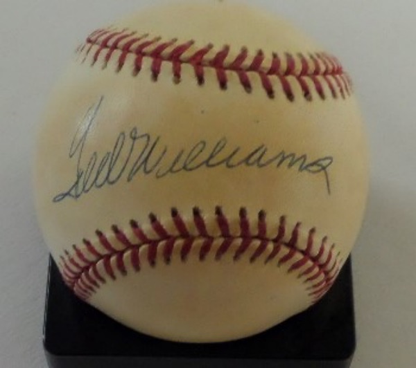 This Official American League Baseball from Rawlings is in G/G+ condition, and comes hand-signed in blue ink across the sweet spot by lifetime .344 hitter, Ted Williams.  The signature grades a clean, legible 8+, and with his death now over 20 years ago, the ball is valued at $500.00!