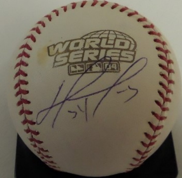 This Official 2004 World Series Baseball from Rawlings is still in EX overall condition, and comes hand-signed on a side panel in blue ink by one of the great clutch hitters of all time, HOF'er, David Ortiz!  The signature grades a legible 8, and this beautiful Red Sox collector's item is valued into the mid hundreds!