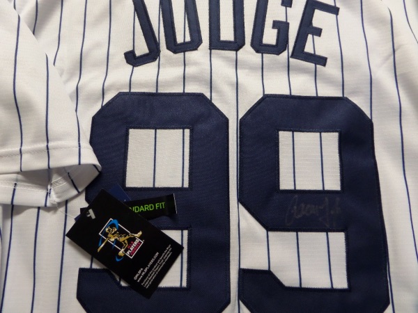 This home white gem is authentic and mint!  It comes signed on the back #99 in silver by this homerun-hitting slugger who ran away with the HR crown a few years ago (and MVP).  Guaranteed authentic and retail is into the low thousands and rising as they made it to the World Series this past year and are primed for a run again! He is the MVP favorite this year already!