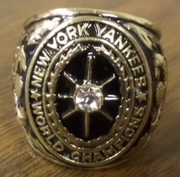 This GORGEOUS ring is approx. a mans size 8-9 and loaded with a gorgeous large CZ in the middle on the top of the ring, with New York Yankees World Champions, surround the stone. It has the Yankees Logo on each shank with 1927 Under that, and has alot of engravings. This Gorgeous ring is an exact replica of the REAL RING that was given to players on that Great Yankee team with "MURDERERS ROW", BABE Ruth, and more--w/ GH Babe Ruth engraved on the inside, and the value of this beauty is HIGH.