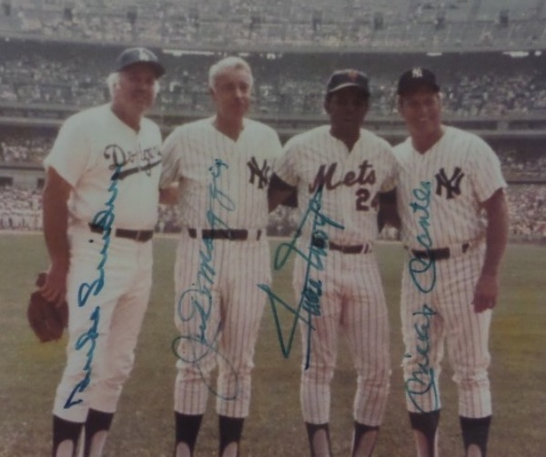 This 8x10 is a color Old Timers Day photo of the four great, Hall Of Fame center fielders from the New York teams of the 1950's.  It is hand-signed in blue felt tip marker by all four, including Duke Snider, Mickey Mantle, Joe DiMaggio and Willie Mays, with all four diamond dandies now deceased, and this photo is valued well into the high hundreds!