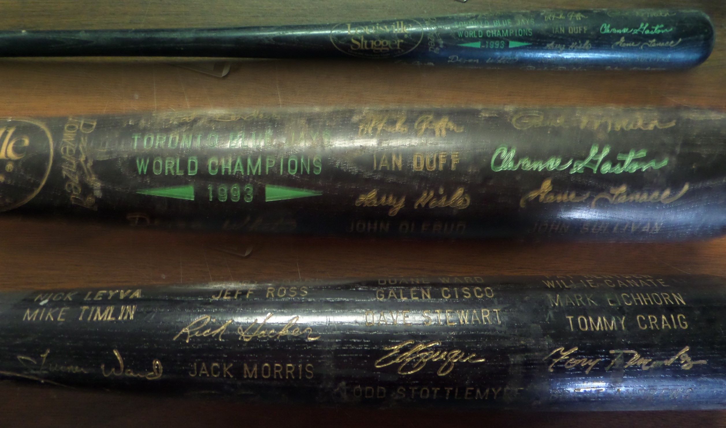 This black Louisville Slugger baseball bat is still in EX shape, with TORONTO BLUE JAYS WORLD CHAMPIONS 1993 in green block lettering on the barrel.  It features names and facsimile signatures of this star-laden World Champion ballclub, including Molitor, Carter, Henderson, Gaston, Stewart, Alomar and all the rest.  These bats, according to our consignor, were only given to players and team VIP's, and so they're pretty RARE!!!
